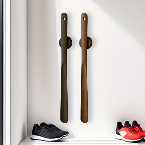 Minimalist wall-mounted wooden shoehorn for the entryway