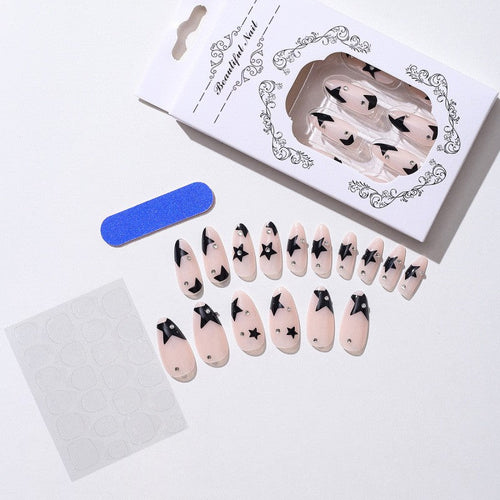 Glitter nail polish with stars and a moon for manicures