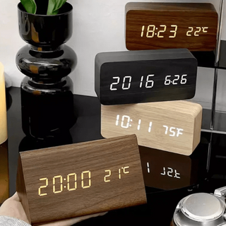Digital alarm clock with LED display and thermometer