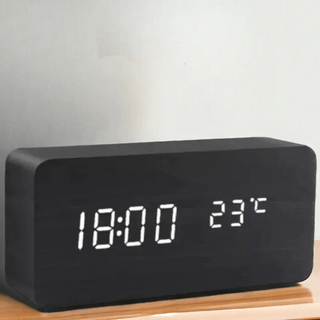 Digital alarm clock with LED display and thermometer