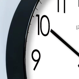 Round modern wall clock with silent movement for the living room