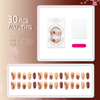 Press-on nails with rhinestones, an ombré effect, and various shapes