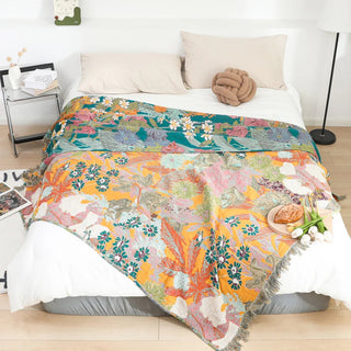 Couvre-lit patchwork avec broderie florale et franges