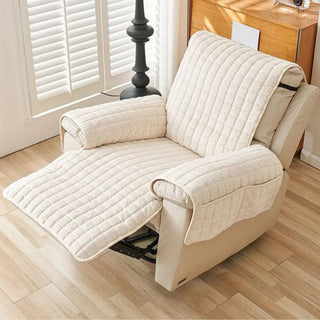 Quilted reversible armchair throw with side pockets