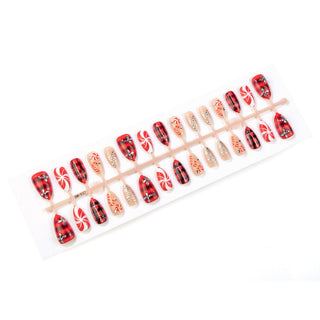Press-on nails with rhinestones and Christmas designs
